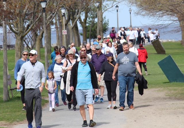 People hike along a trail.