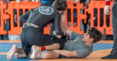 Two people battle it out in Jiu-Jitsu.