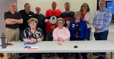 A group of people pose for a photo.