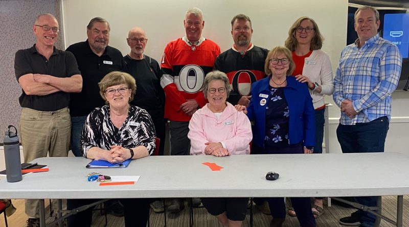 A group of people pose for a photo.