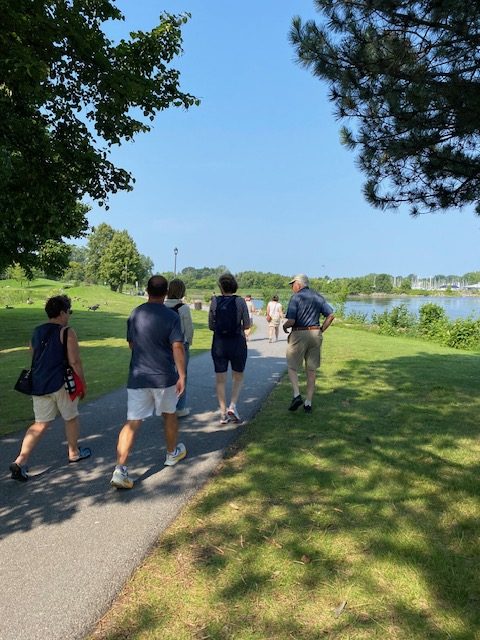 People walk on a trail.
