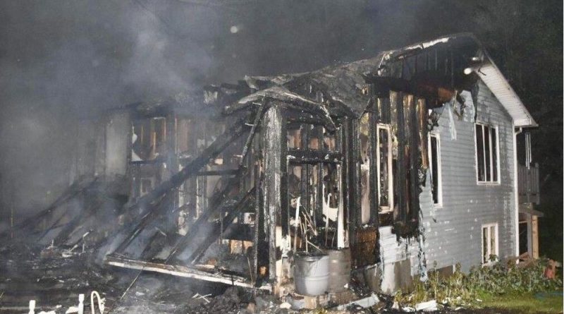 A photo of a burnt house.