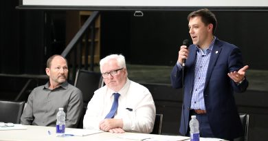 A person speaks in to a mic.