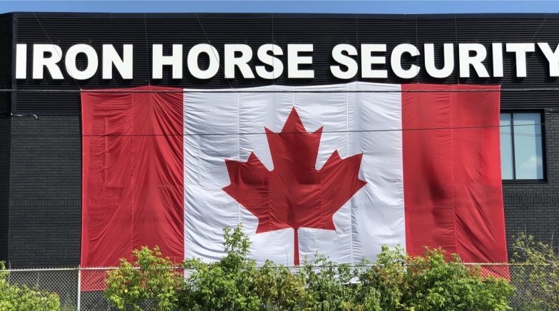 A photo of a big flag on a building.
