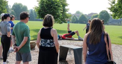A person does excercises on a bench.