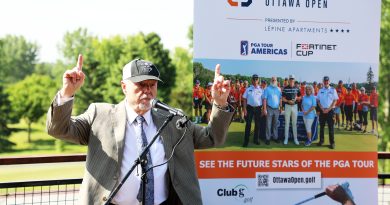 A photo of a man celebrating a tournament coming to his golf club.