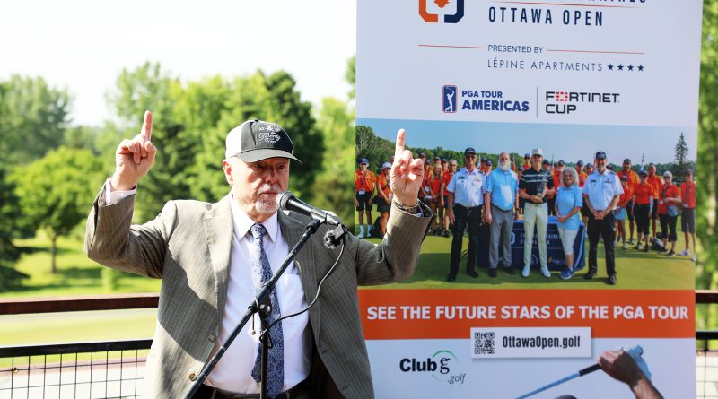 A photo of a man celebrating a tournament coming to his golf club.