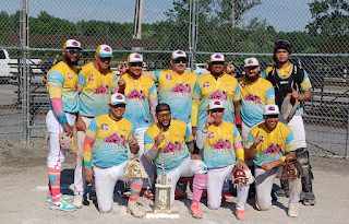 A ball team poses for a photo.