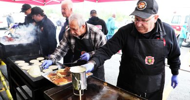 Firefighters make breakfast.