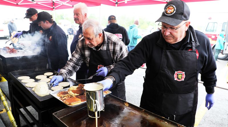 Firefighters make breakfast.