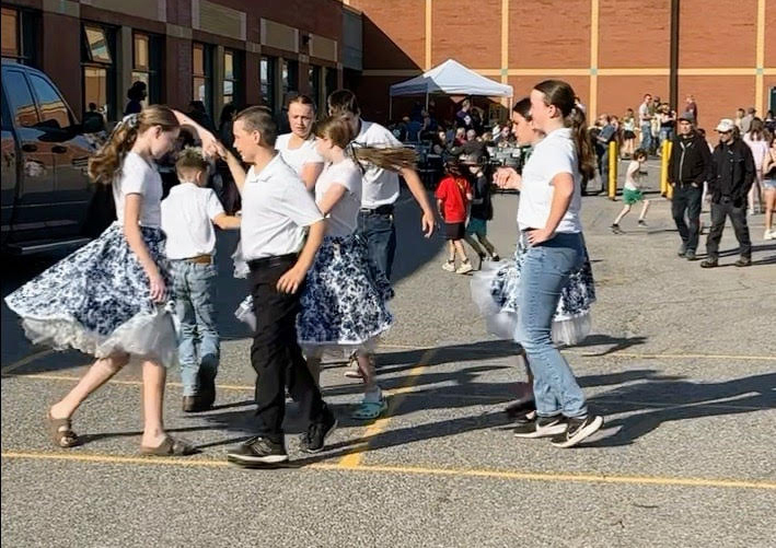 Kids square dance.