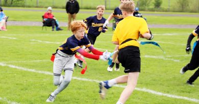 A photo of people playing flag football.