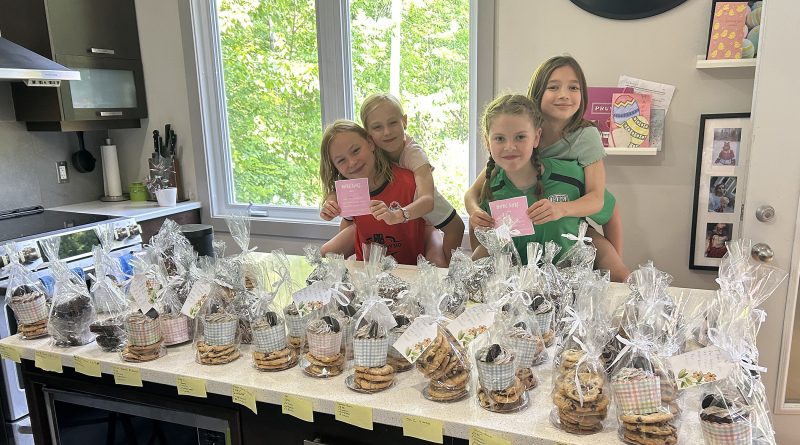 Four youth pose with their baked goods.