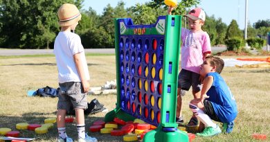 A photo of kids playing connect four.