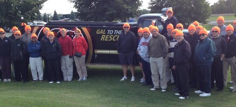 A group of employees pose for a photo.