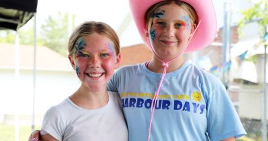 Two kids pose for a photo.