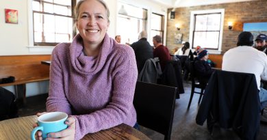 A woman drinks a coffee.