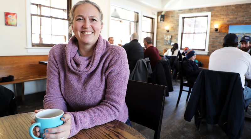 A woman drinks a coffee.