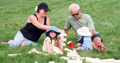 A family plays in a park.