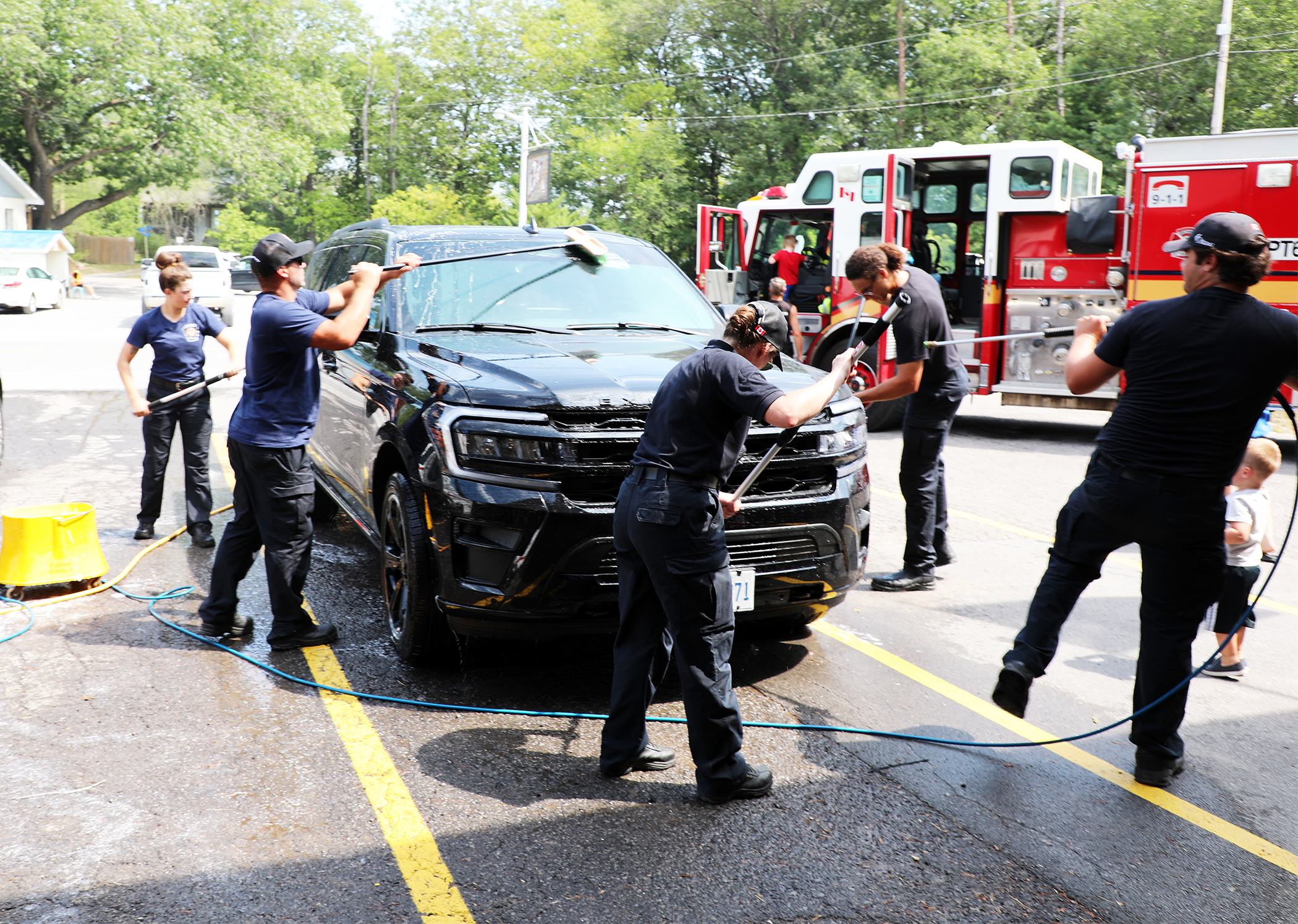 Station 63 washes cars in quiet summer