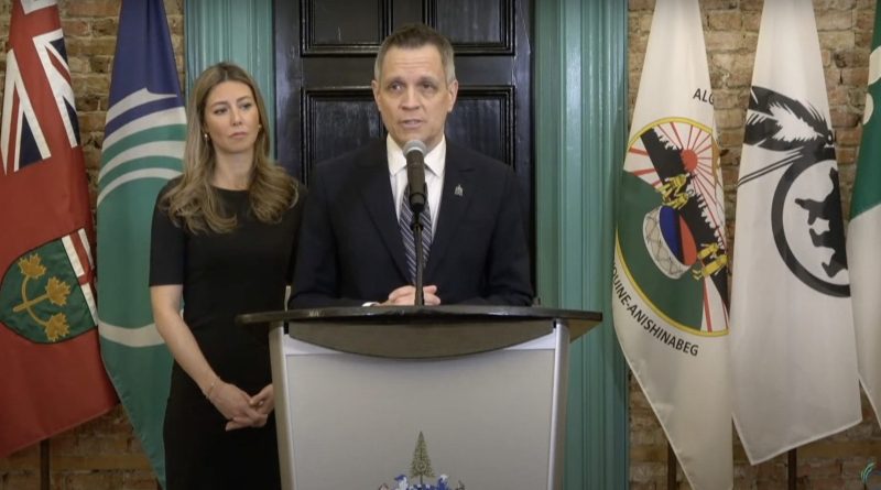 A mayor stands at a podium.