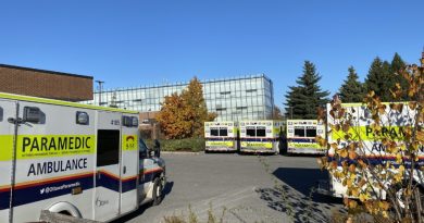 A photo of ambulances at a hospital.