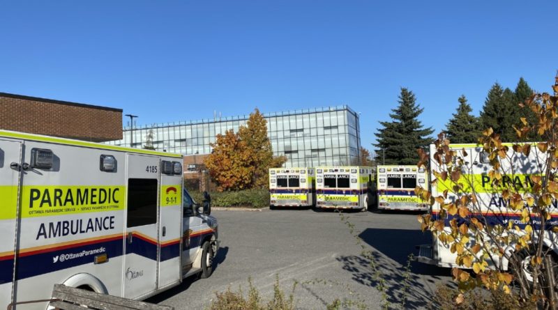 A photo of ambulances at a hospital.
