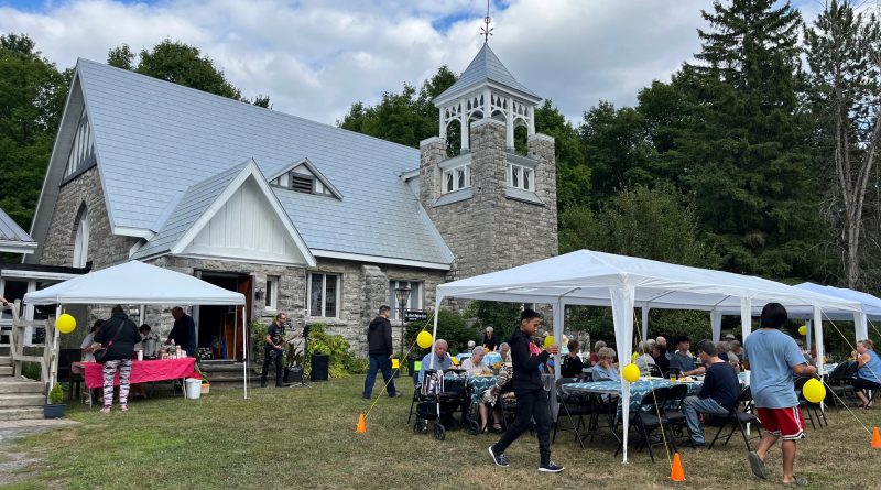 A photo of tents and a church.