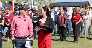 Two people give speeches at a fair opening.