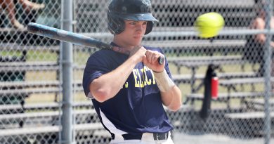 A player gets out of the way of a ball.