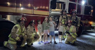 A photo of Corkery firefighters and kids.