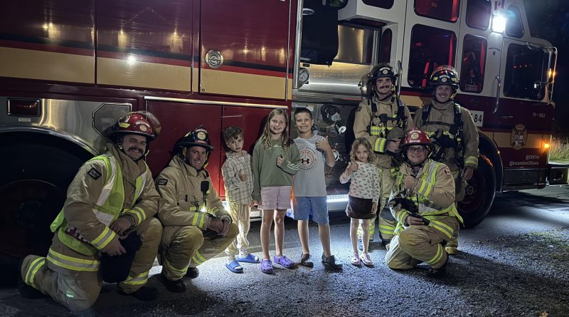 A photo of Corkery firefighters and kids.