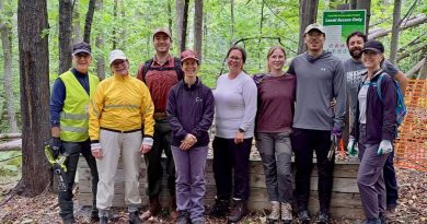 A group of people pose for a photo.