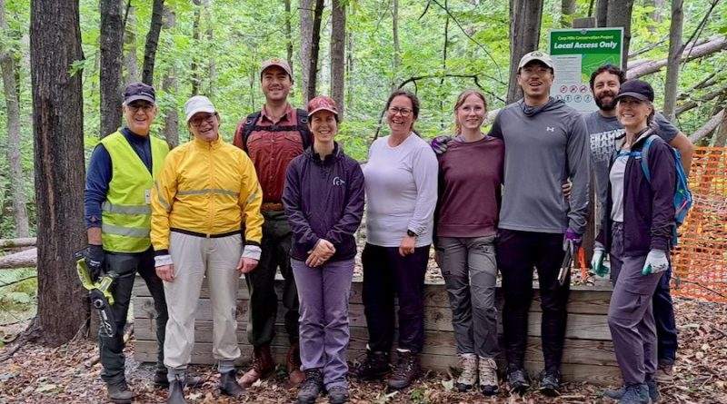 A group of people pose for a photo.
