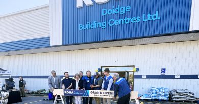 A group photo at a grand opening.