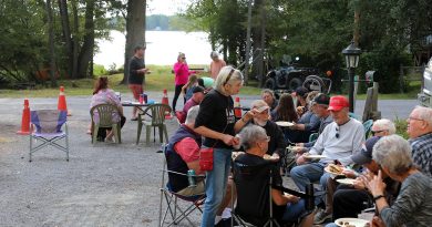 People eat at a barbecue.