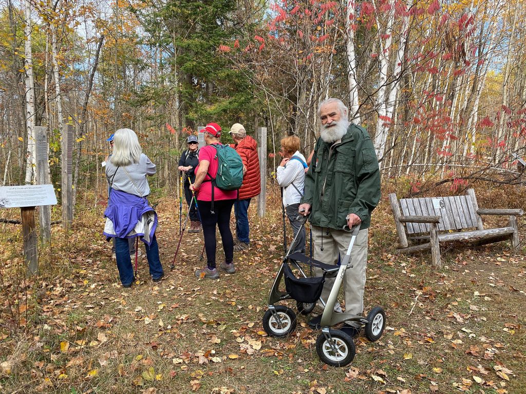 People pose in the forest.