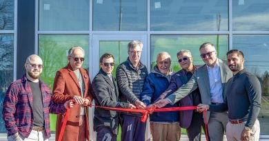 People cut a ribbon.