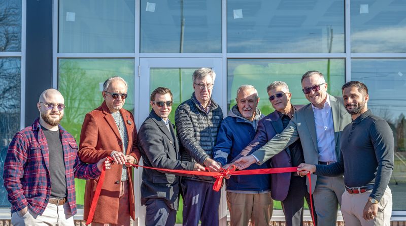 People cut a ribbon.