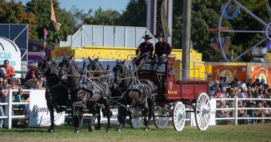 A four horse hitch goes around the ring.