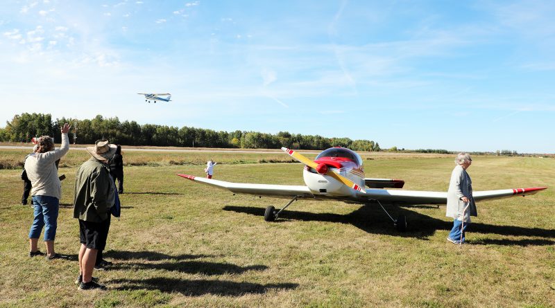 A photo of airplanes at an airport.