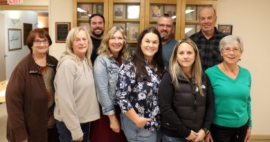 A group of people pose for a photo.