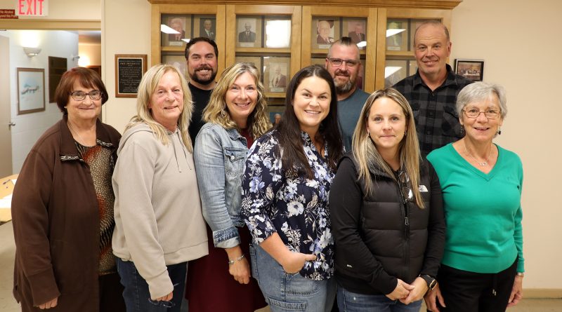 A group of people pose for a photo.