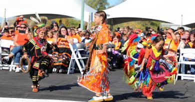 Three younf performers do a dance.