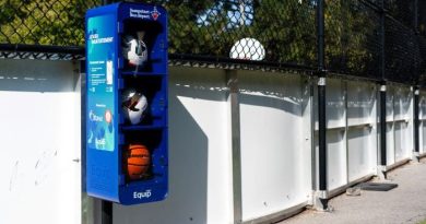 A photo of a locker holding sports equipment.