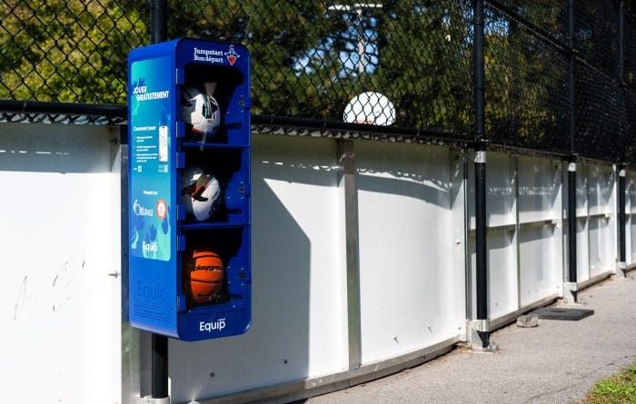A photo of a locker holding sports equipment.