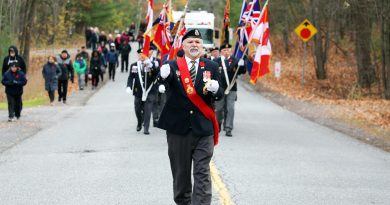 A colour guard parades.