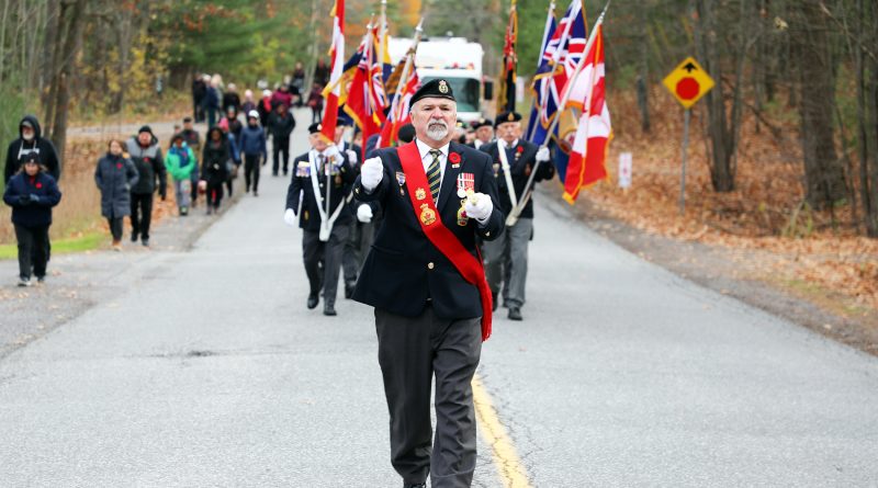 A colour guard parades.