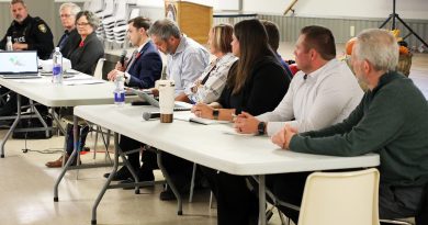 A group of people sit at a table.