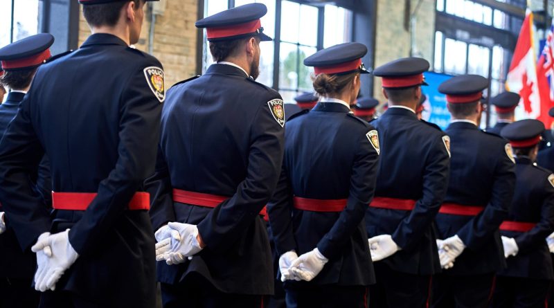 Police stand at attention.